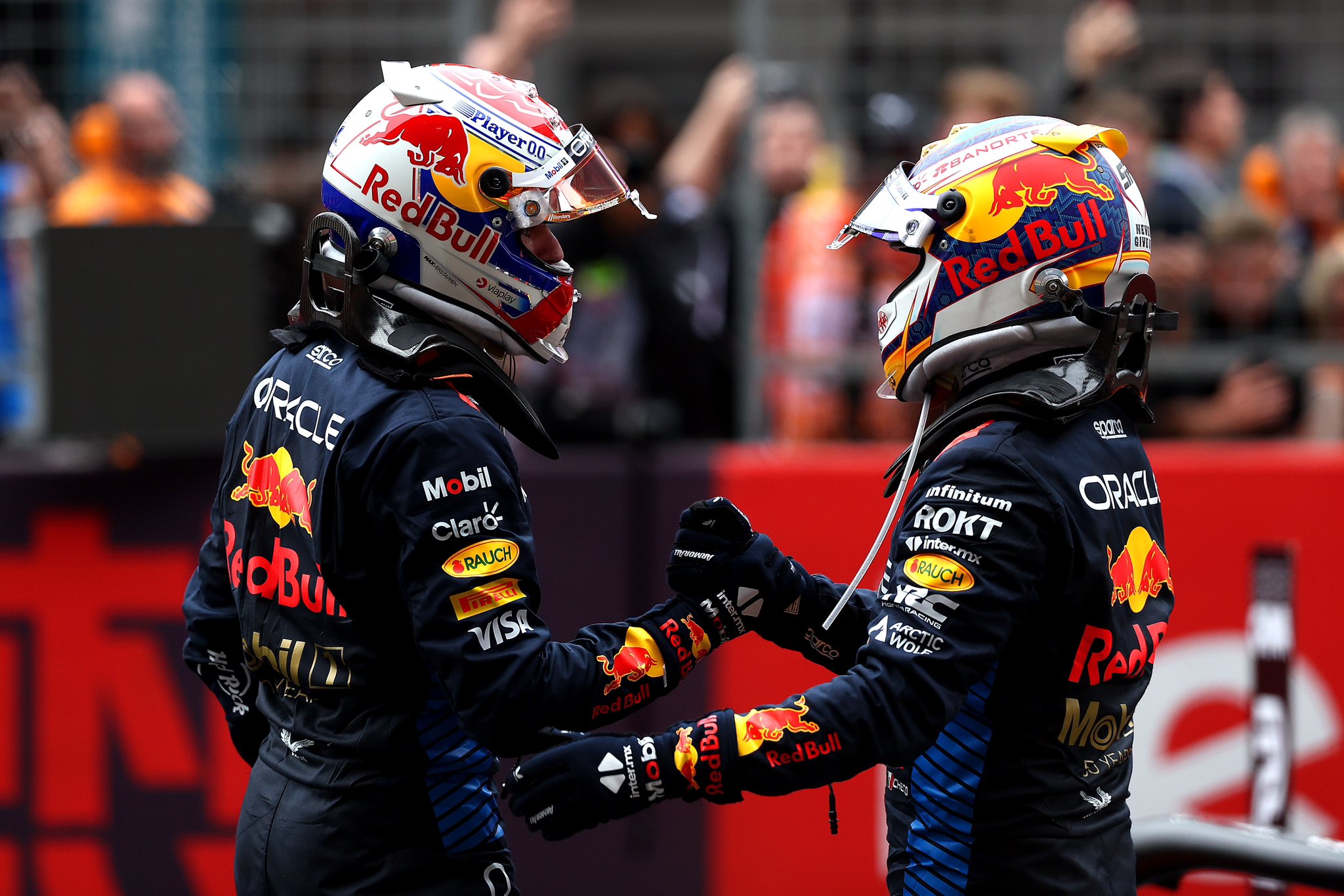 Max Verstappen and Checo Perez congratulate each other in Parc Ferme after completing the Chinese GP in P1 and P3