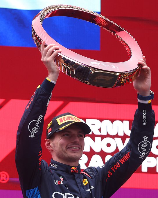 Max Verstappen holds up his winners trophy after the 2024 Chinese Grand Prix.