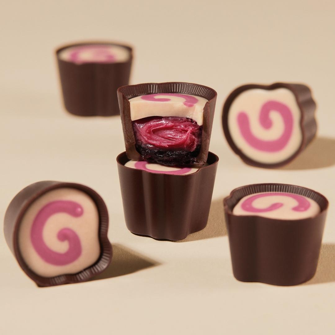 Introducing our first-ever compote-ganache recipe - the Triple Cherry Selector. 🍒 A riot of tart cherry in three layers: jammy compote and creamy ganache, with a solid cherry-white chocolate cap. Served in a 70% dark cup. Hands up if you've tried it ✋