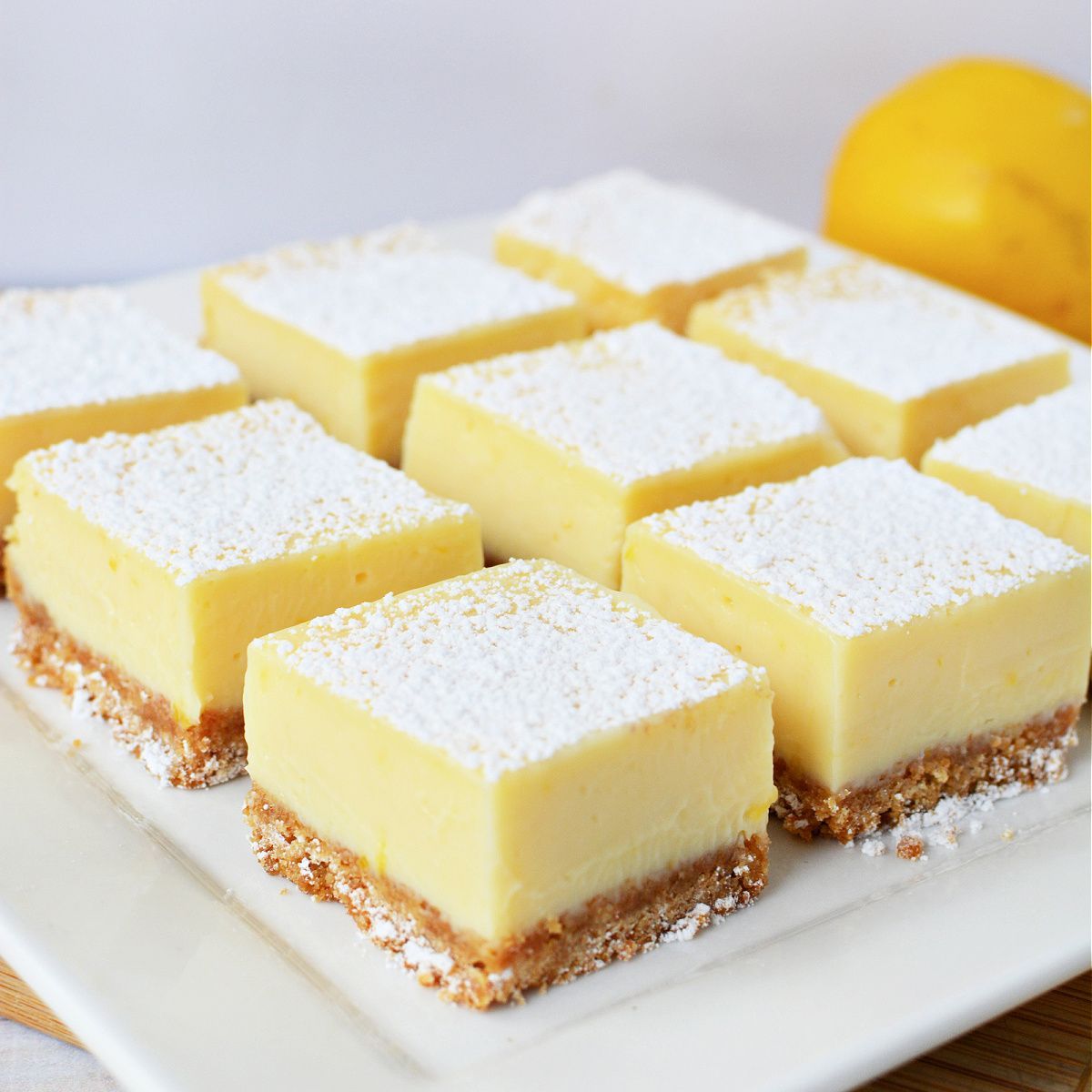 These Lemon Bars with Graham Cracker Crust are rich, decadent, brightly flavored lemon cheesecake bars that explode with sweet and tangy flavor in every bite. And bonus - these tangy lemon bars are super easy to make! Get the recipe here: therebelchick.com/lemon-bars-wit…