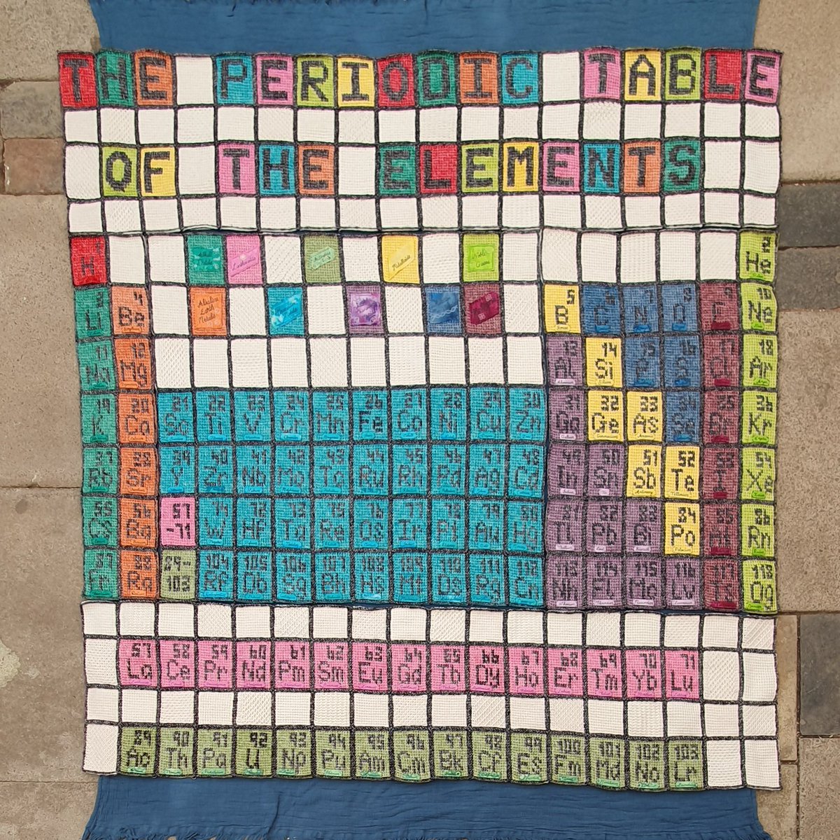 WoolyScientist's tweet photo. Very nearly finished my tunisian crochet blanket of the Periodic Table of the Elements! 

All that's left is to add a border 😊😊😊

#SciArt https://t.co/xAlXwbaI9x