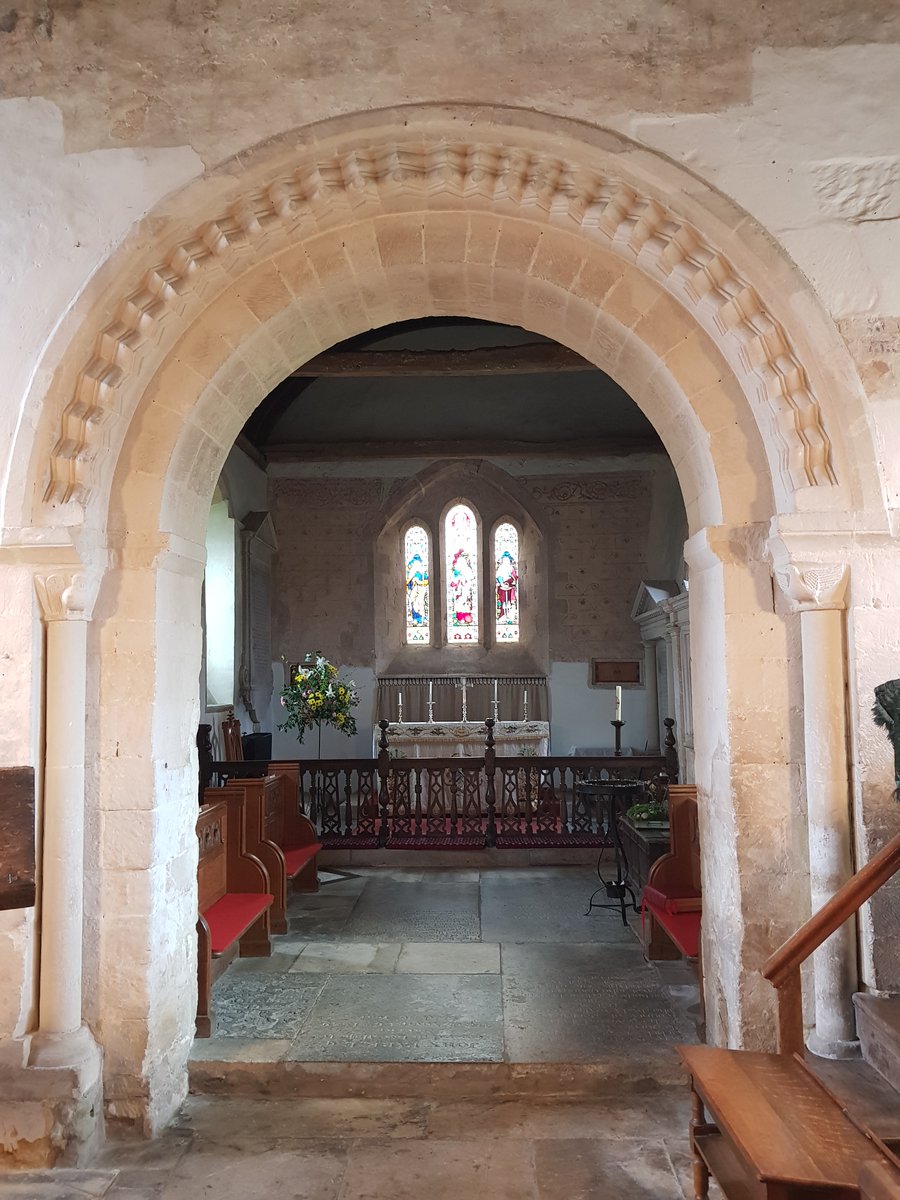 The chancel #StAndrewDurnford seen through chancel arch. 
The nave is late C12, the chancel early C13 and yet the chancel arch is Romanesque. Two order; inner chamfered, outer with deep chevron relief. Very well preserved. Too well preserved?
#StoneworkSunday #SundayStonework