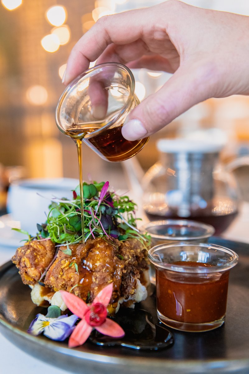 Sweet and savory! The best of both worlds. This is our Chicken & Waffles — fried chicken thigh, Nashville hot sauce, liege-style waffle, truffle jalapeño honey butter, and rum barrel-aged maple syrup. Brunch is served every Sat & Sun from 11am - 2:30pm. exploretock.com/lhrooftop