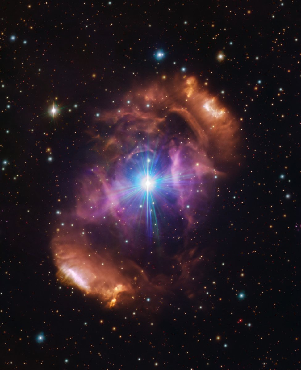 Our scientists help us see the wild, incredible beauty of the universe. (twin stars surrounded by a post-collision nebula, from @ESO. Details: tinyurl.com/56wxsb69)