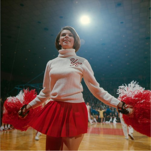 A University of Houston cheerleader on the court during the National Semifinals game against UCLA at Freedom Hall. Louisville, Kentucky. March 24, 1967 #NeilLeifer #Photography #Basketball #Cheerleader