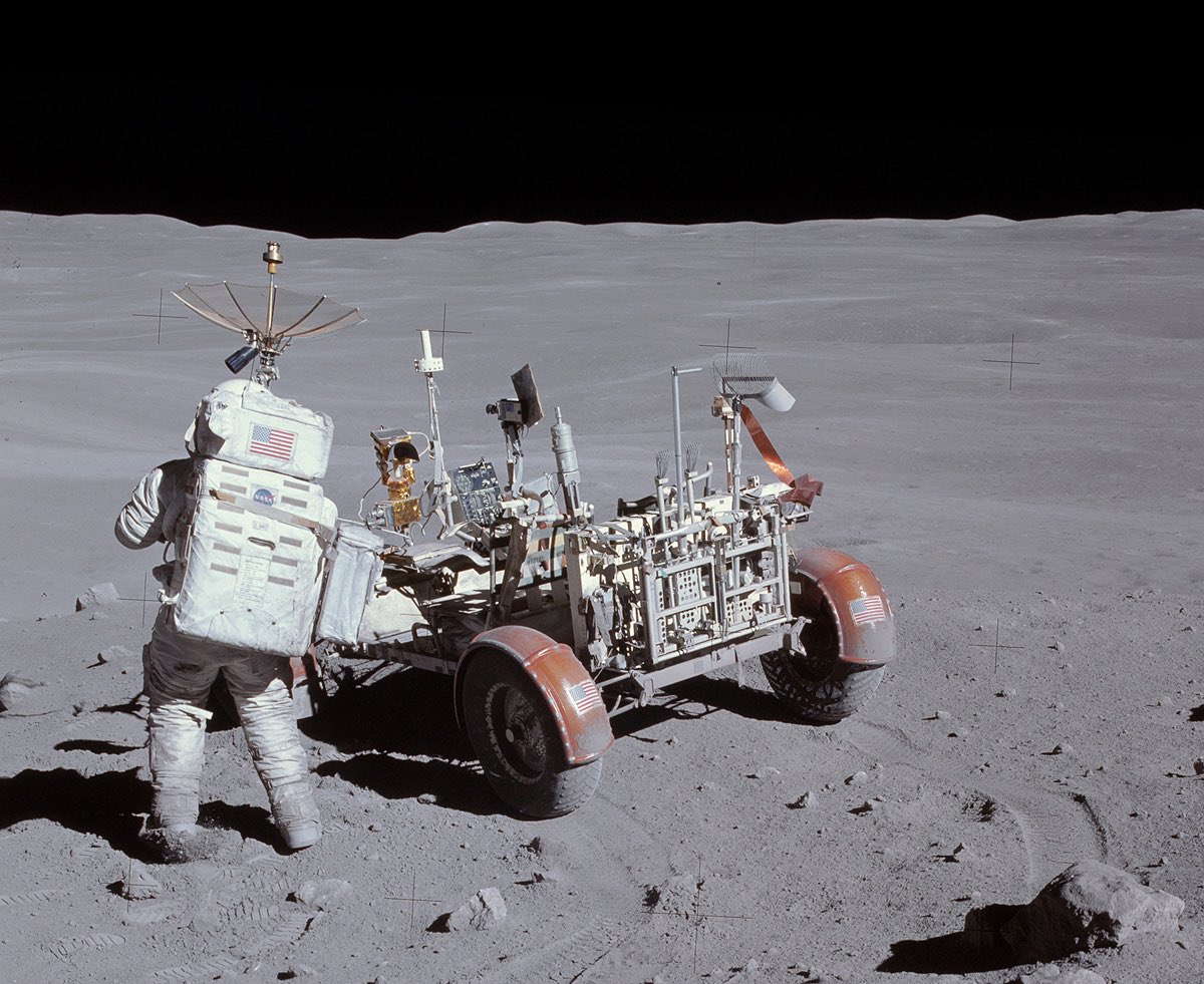 On this day 1972 - Apollo 16 EVA 2 This photo shows Charlie Duke next to the rover with a stunning view at Station 4 #apollo16