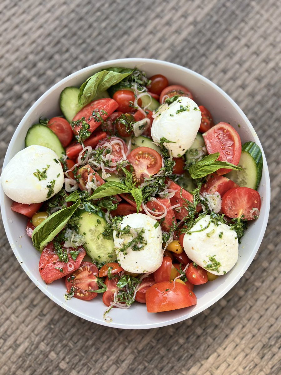 Spring tomato salad with a shallot herb vin is the perfect dinner party dish to share with friends.