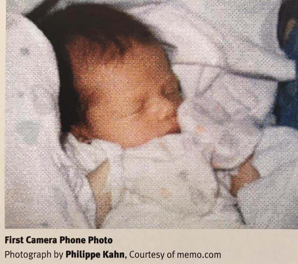 First cameraphone-shared pic, in: 100 Photos That Changed the World, taken Jun 11, 1997, Santa Cruz, CA, by P Kahn & sent to 2,000 contacts. (Image below captured from print copy of 100 Photos given to me by Khan's friend, Founder of Jawbone, the 1st fitness wearable company).