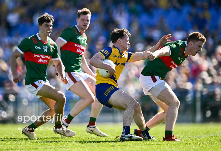 Ben O'Carroll of Roscommon tries to fend off Mayo players Tommy Conroy, Matthew Ruane and David McBrien during the @ConnachtGAA SFC semi-final at Dr Hyde Park. 📸 @PiarasPOM sportsfile.com/more-images/77…