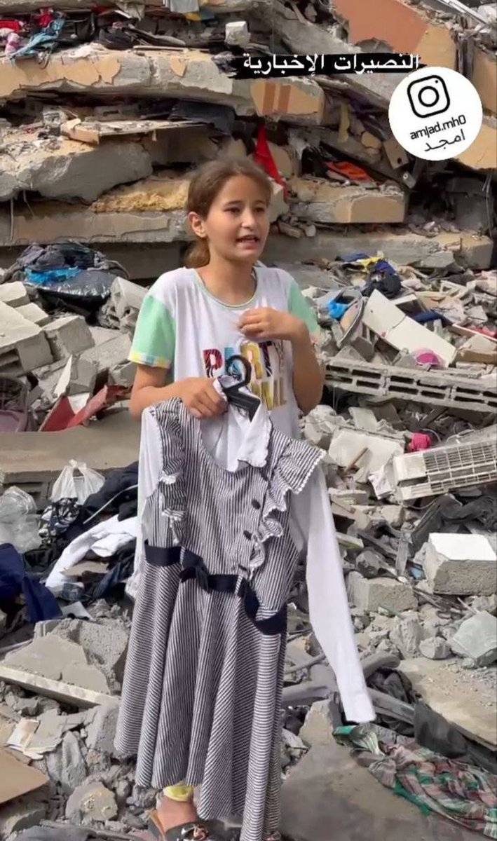 💔🇵🇸 A little Palestinian girl retrieves her school uniform from her DESTROYED HOME, despite the fact that she may never go to school again.