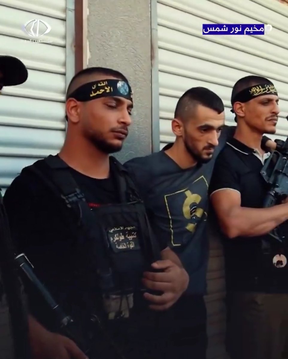 Mohammed Jaber, nicknamed Abu Shuja' (Father of Courage), surrounded by two bodyguards. He is the commander of the Tulkarem Battalion militia and is wanted by both the Palestinian Authority and Israel. His militia is one of the biggest in the northern West Bank.