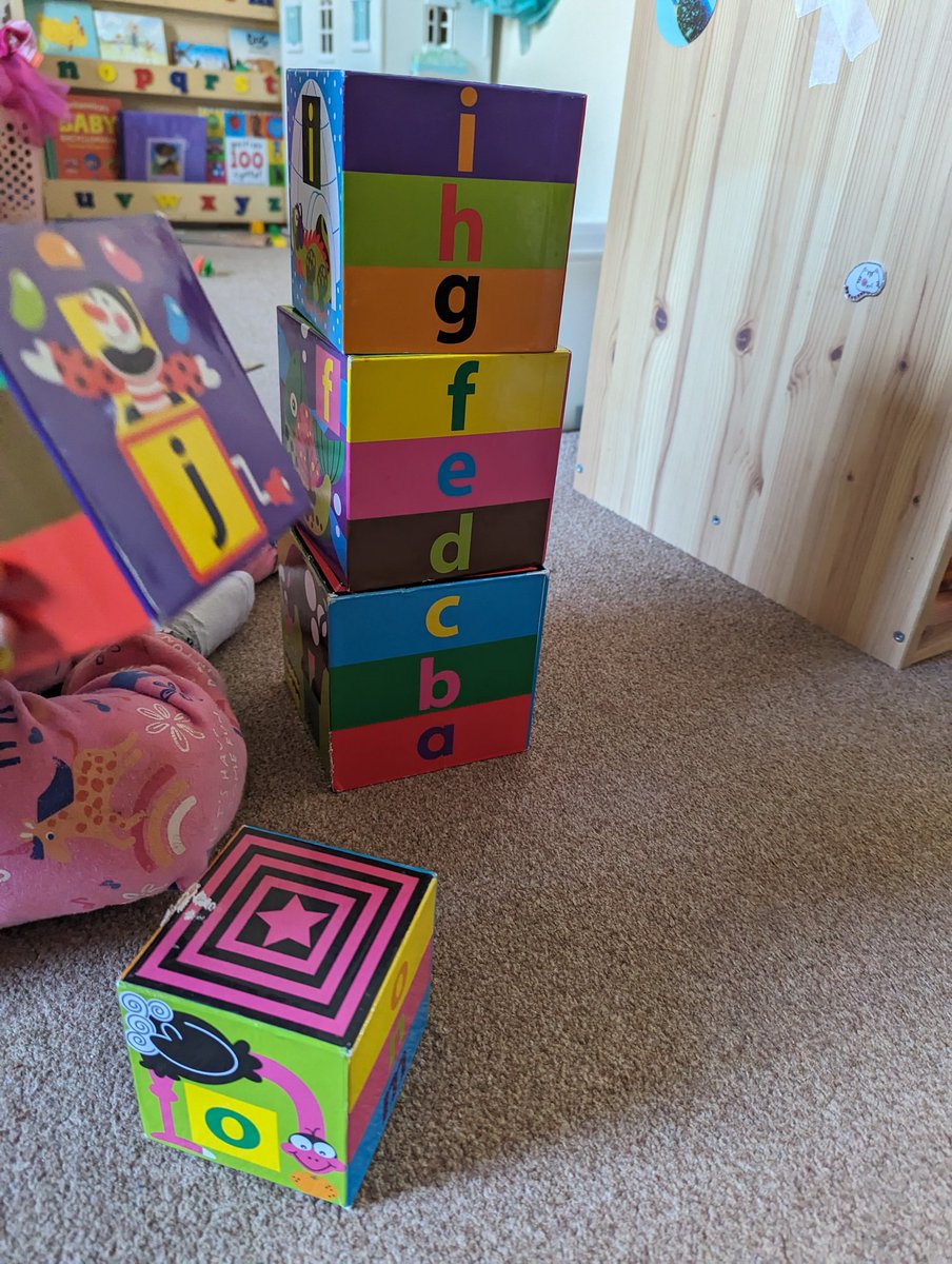 Two weekends ago, the toddler took this cube to the pier and left it there by accident. We went back today and it was in the box of toys they keep in the cafe at the end of the pier. She's treating it like she's recovered the medallion from Raiders of the Lost Ark.