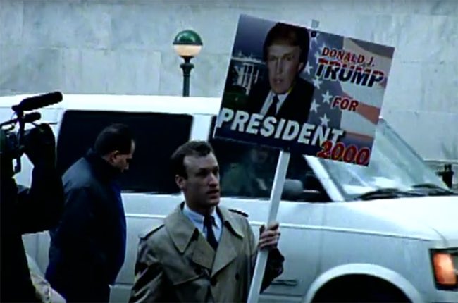 'Donald J. Trump for President 2000' sign in Rage Against the Machine's 1999 music video for 'Sleep Now in the Fire.' Who knew @RATM was so ahead of the game? 🎸🔥