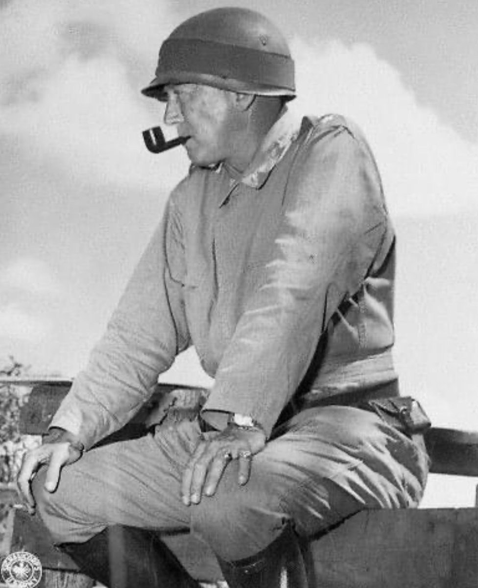 General George S. Patton sits on a fence & smokes a pipe while observing 1941 maneuvers in Louisiana. 🪖