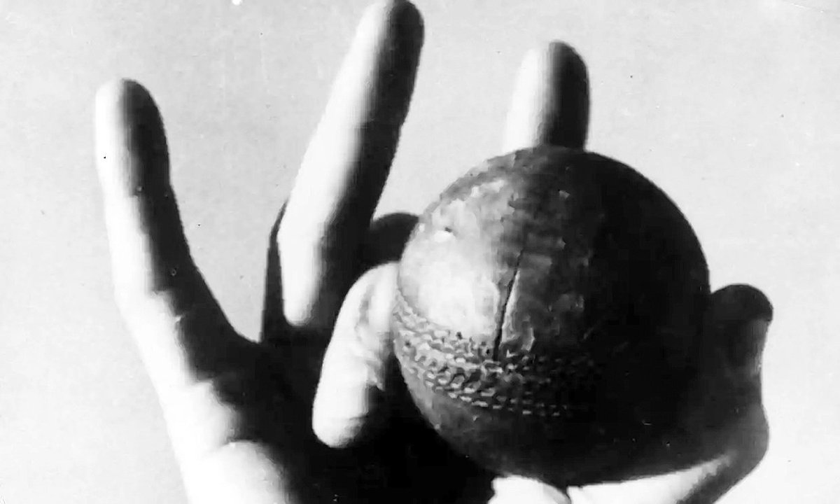 Jack Iverson showing his unorthodox grip which allowed him to bowl off breaks, leg breaks and googlies without any discernible change of action. Called into the Australian side for the 1950-51 Ashes aged 35 he took 21 wickets at 15.23 - he also scored 3 runs at 0.75!