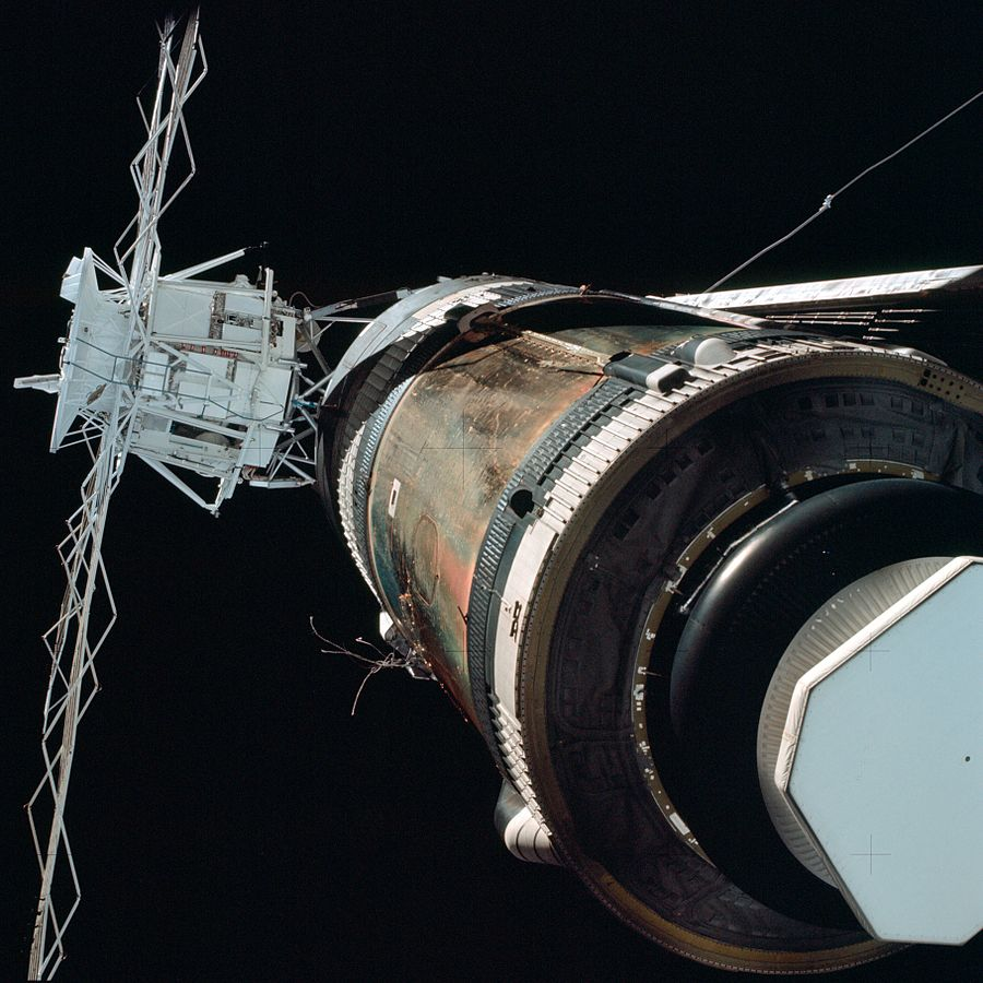 The crew of Skylab 2 get their first look at the station post-launch. On the left side we can see the remaining wires from the solar panel that tore off entirely, and on the right we can see the other solar panel, jammed and unable to deploy.