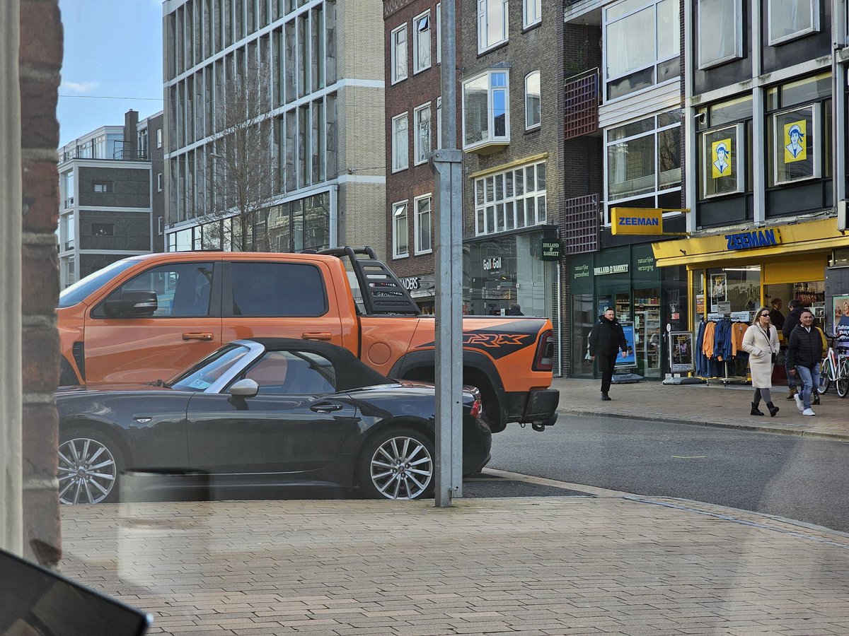 DavidTheScintst's tweet photo. @turboyimby @AmericanFietser Here's how a Ram looks in the Netherlands next to an MX-5 sized car, the Fiat 124. Comical and scary... https://t.co/rn2KLjiCar