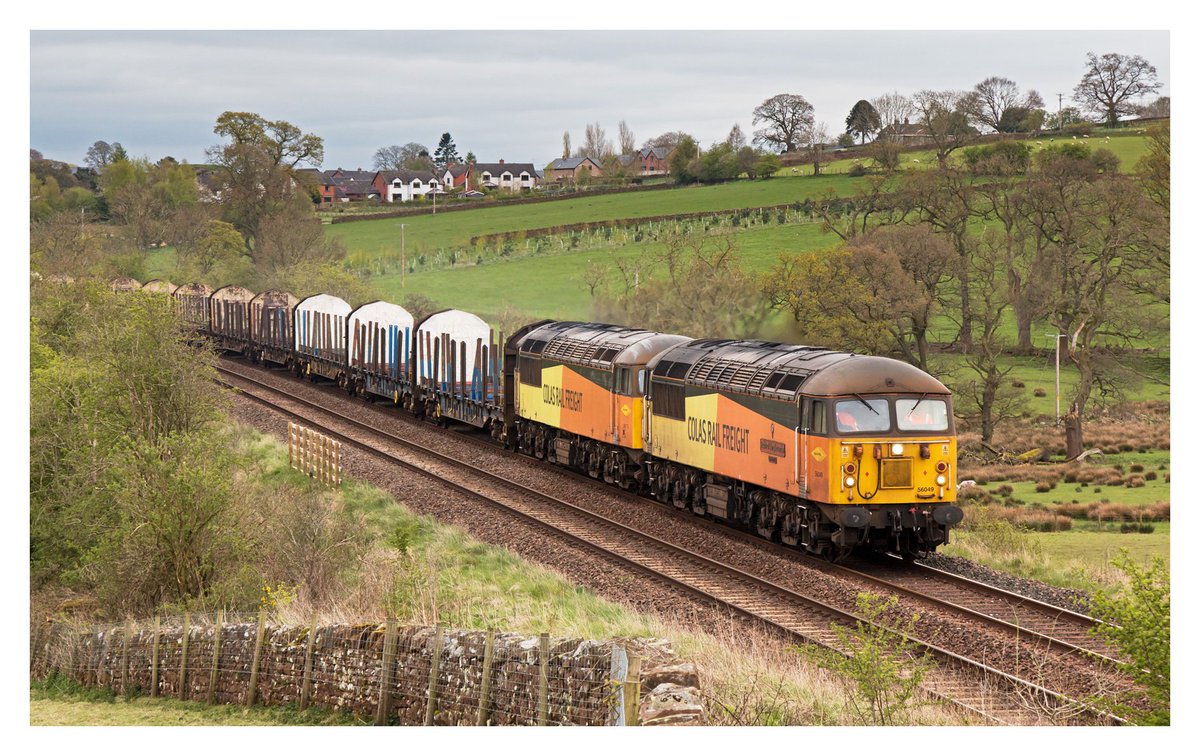 56049 + 56113 head past Lazonby on the 6C37 1030 Chirk Kronospan - Carlisle Yard, 21st April 2024. A rare opportunity to photograph the northbound working over the S&C.