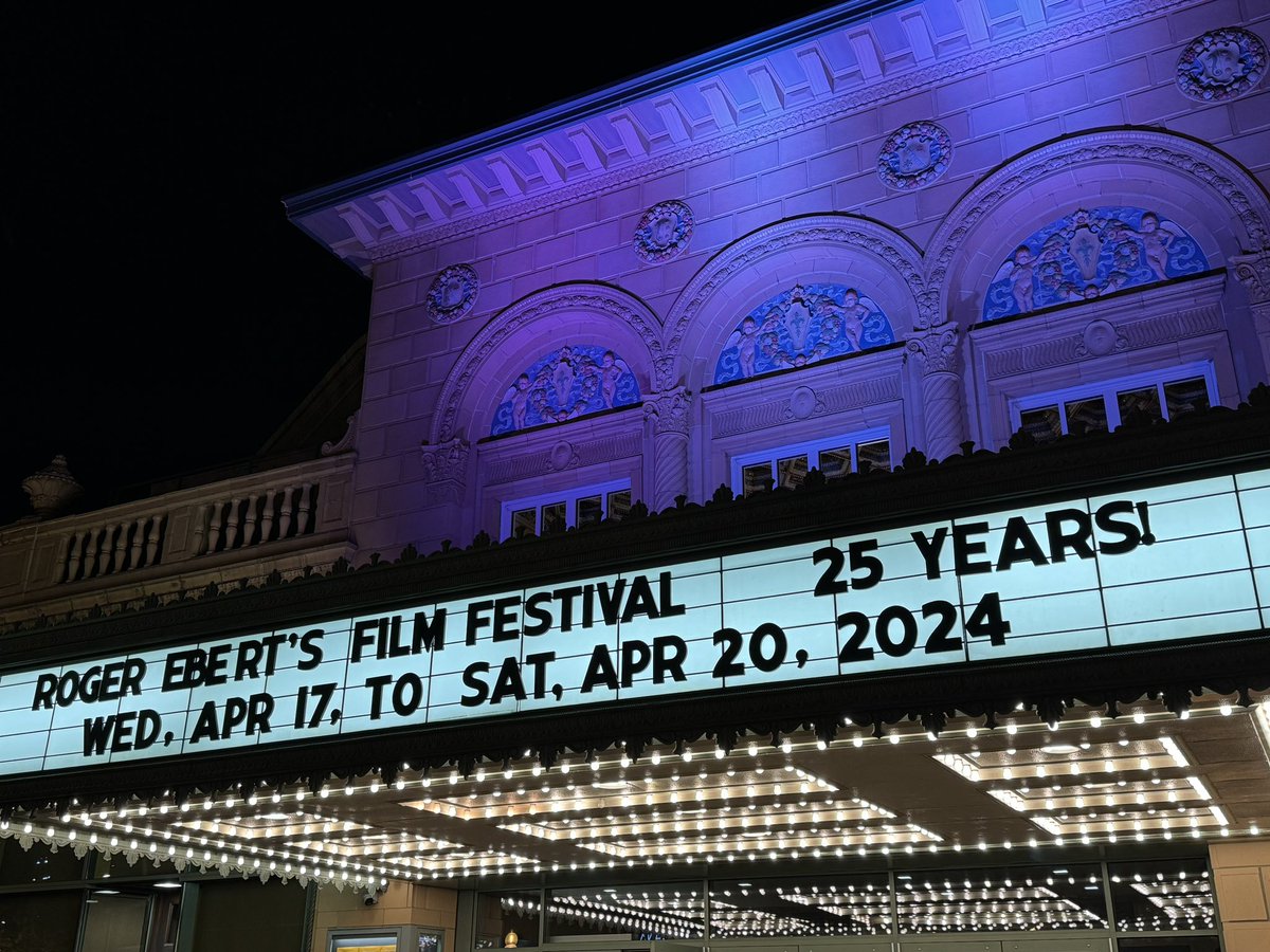 markpfeiffer's tweet photo. Ebert sculpture, the fabled men’s room view of downtown Champaign from the Virginia Theatre, Scott Alexander and Larry Karaszewski with Chaz Ebert after MAN ON THE MOON, and the marquee at night. #Ebertfest https://t.co/Mp6QCXxoze