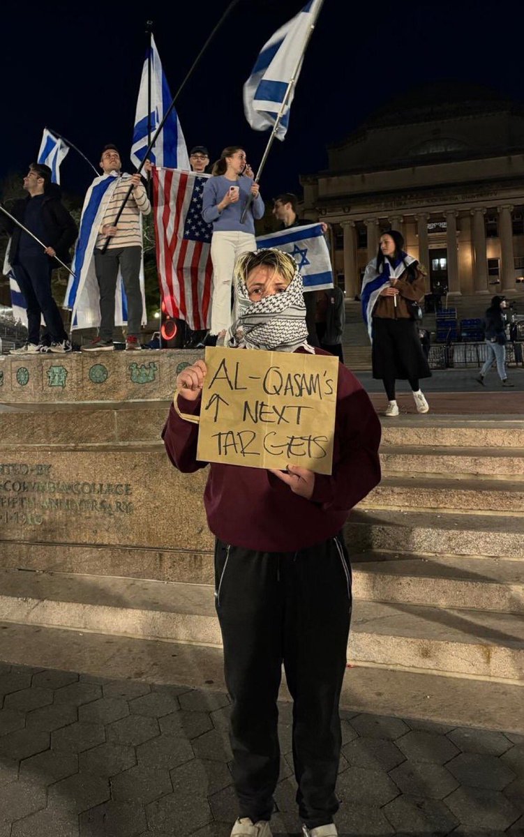 #NeverAgainIsNow Brave white savior is a boy? Girl? Face covered with a rag of death, he/him/she/her/they/them are calling for the death of Jews, Hamas style, which could be rape, beheading, burning, shooting or stabbing. Get these beasts off our college campuses. NOW.