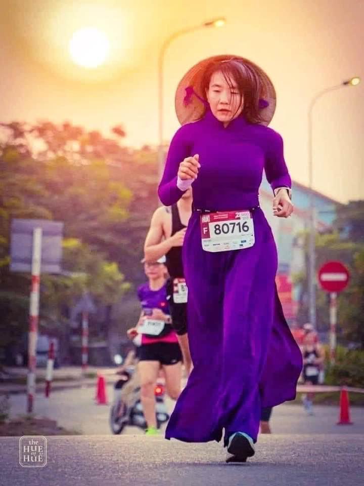 Woman in traditional ao dai ran a marathon in Hue yesterday. I love it!