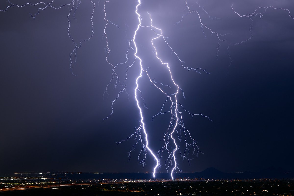 Close range lightning photography tip: When shooting bolts inside 1 mile, shoot in bulb mode and close the shutter immediately after the strike. Why? Even if your focus is perfect, the shockwave from the thunder will introduce vibrations and make your foreground look blurry.