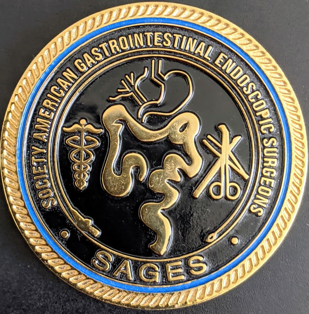 Charlotte Horne has recieved a #SAGES2024 Recognition of Excellence Coin from Eric Pauli for Dr Horne was the poster-co chair, a member of the PTPT, chaired a hernia session and also co-lead the group run.