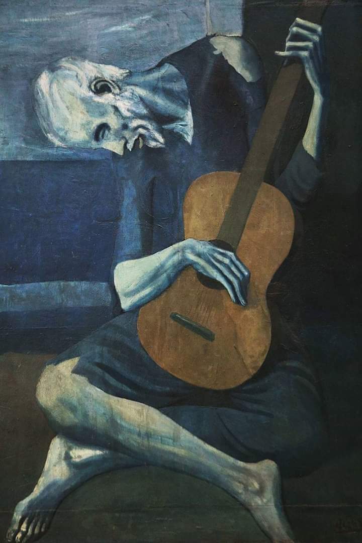 #PabloPicasso
The Old Guitarist 
(1903-1904)
Oil on panel
122.9 × 82.6 cm (48 3/8 × 32 1/2 in.)
(The Art Institute of  Chicago)
 In this period he restricted himself to a cold, monochromatic blue palette, flattened forms & emotional themes of human misery and alienation.