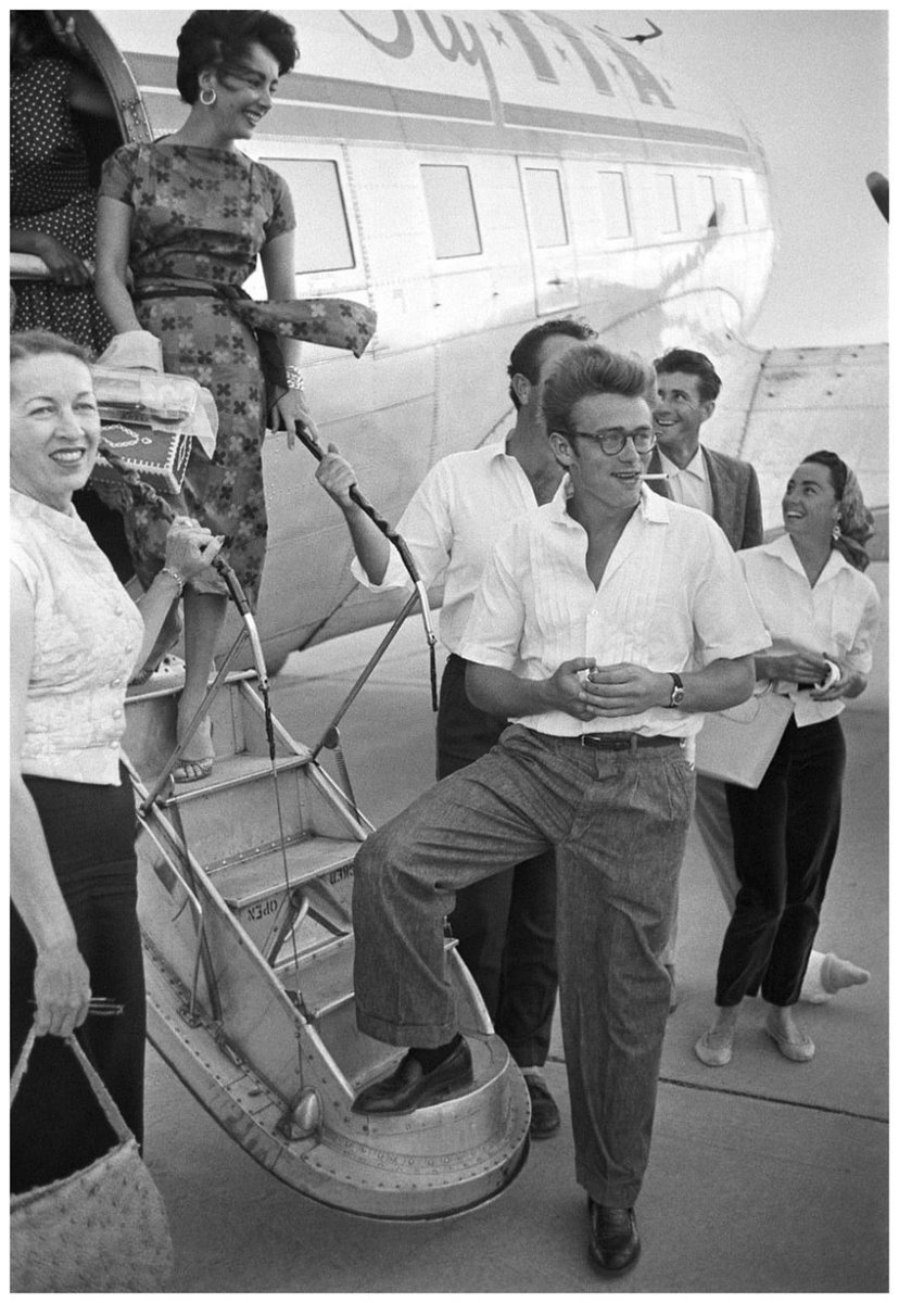 1955: On a windswept tarmac, Elizabeth Taylor and James Dean board the plane to the Texas locations for GIANT.