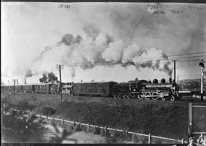 Royal train nearing Dunedin, of the tour of the Duke and Duchess of York in 1927. Two steam locomotives pull the train, 'Ub' class 321, and 'Ub' 322. Source: National Library of NZ natlib.govt.nz/records/232238…