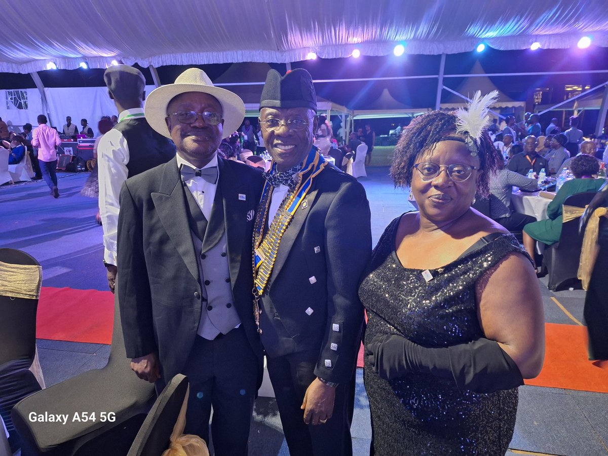 A great photo moment of DG Edward , PP Maggie and I at the DG's banquet in Munyonyo during the 99th DISCON.