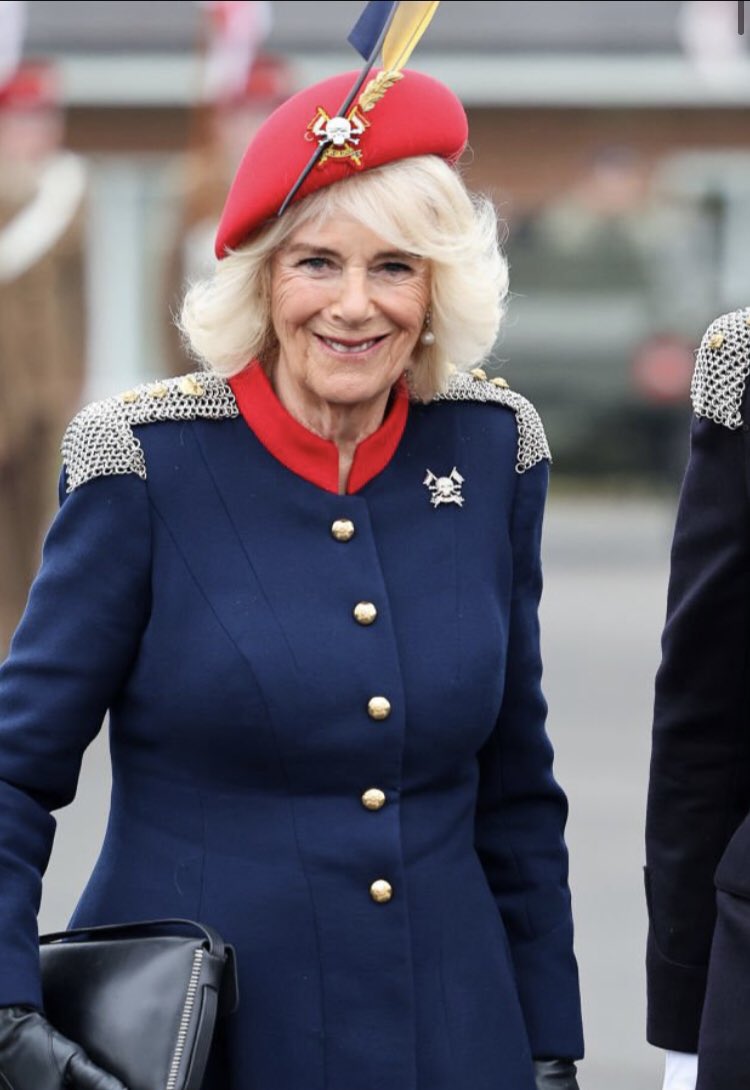 Queen Camilla today! She looks to be wearing Fiona Clare but I am not sure