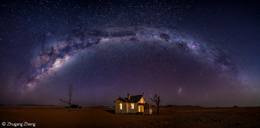 📷The Milky Way stretches over the lonely and eerie Garub Railway Station in the Namib Desert. Namibia. © Zhugang Zheng (Photographer of the Year 2024 entry) #photography #culturephotography #Africaphotography #traditionalphotography