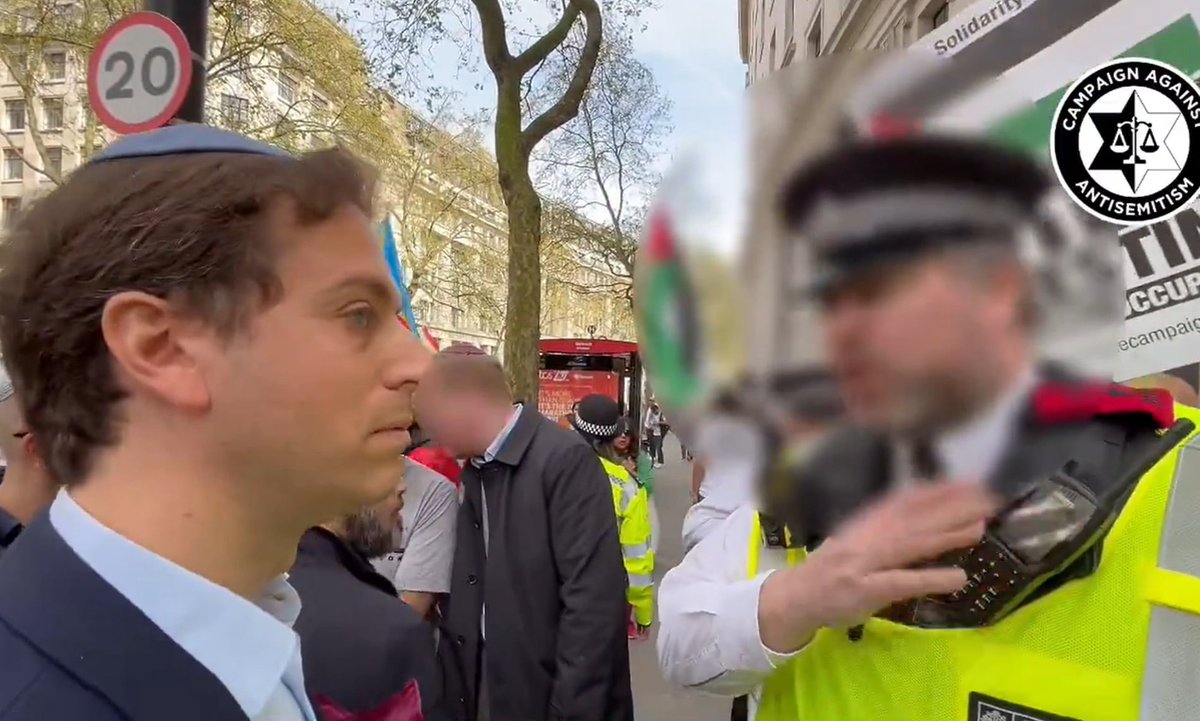 Jonathan_K_Cook's tweet photo. 7 easy steps to outlawing marches that call for an end to Israel's genocide in Gaza:

1. Gideon Falter, chief executive of the Campaign Against Antisemitism, an aggressively pro-Israel organisation which led a smear campaign against former Labour leader Jeremy Corbyn – one enthusiastically amplified by the establishment media – is back in action. 

A week ago he decided to bring a film crew to record his efforts to cross a London street where another enormous march was taking place calling for a ceasefire to end the bloodletting and starvation of the 2.3 million people in Gaza. The march, we should note, is prominently attended every week by Jewish groups to show their solidarity with Palestinian civilians Israel has been slaughtering in their tens of thousands for more than six months, in what the World Court calls a “plausible” genocide. Israel has been ably assisted in its genocidal actions by western governments, including Britain’s. None of the Jewish groups that attend these marches has ever faced a problem for being Jewish.

2. The Metropolitan Police mark off much of the route of the weekly marches with barriers and officers to make it difficult for people to join or leave except at designated points. This is standard practice for big demonstrations nowadays, on the grounds, police argue, that it is their responsibility to maintain public order. 

However, the policing of these marches has also occurred in the context of malicious efforts by Zionist groups, and the political and media establishment, to smear those attending the anti-genocide protests as trouble-makers and Jew haters – based on precisely zero evidence. A group of Holocaust survivors that are among the many Jewish groups that attend has stated: “Every major pro-Palestine demonstration in London has included a large Jewish bloc, which has received nothing but support and warmth from their fellow demonstrators. Claims that these protests are no-go zones for Jews are completely untrue.”

3. Filmed by his supporters, Falter made a big show of his desire to cross the march at a location where he knew the police were likely to object. Presumably his skull cap offered an added benefit – in addition to the film crew – that the police were more likely to flag him and try to stop him. Falter, of course, did not actually want to cross the street. He wanted to be filmed being stopped from crossing, so he could protest that he was being victimised as a Jew. The police duly obliged. The whole non-incident was captured on film, which was then hurriedly supplied to the BBC and other media.

4. In the film, an officer is shown providing Falter with two reasons he cannot cross the road at the chosen point. Those reasons were dictated solely by the policeman:

a) The officer calls Falter “openly Jewish”. That does not appear to be what he actually means, though it is exactly what Falter hopes he will say. As noted, lots of Jews – including Jews who are “openly Jewish”, carrying signs declaring their Jewishness – attend the marches every week. What the policeman actually identifies is that Falter is openly Zionist – which, in this context, means that he vocally supports Israel's “right” to massacre Palestinians in Gaza, including Palestinian children. 

Such confusion between “Jewish” and “Zionist” has been careful cultivated in the British public, including in police officers. Any Jews critical of Israel – such as the ones on the demonstration – are deemed to be “the wrong sort of Jews”. That is why the Labour party under Sir Keir Starmer has been able to expel and suspend Jews – the wrong sort – in unprecedented large numbers, entirely unremarked. For a police officer like this one, any Jew attending the march against genocide in Gaza does not count as a Jew because they are seen as anti-Zionist. Only Jews like Falter, the ones who have pinned their colours to a genocidal Israel, count as Jews.

b) The officer, while stating that he is not accusing Falter of “anything”, adds that he is “worried about the reaction [of the demonstrators] to your presence”. Again, the policeman isn’t saying precisely that he means. With the film crew on hand, he does not want to be caught telling Falter that he suspects he will try to shout out provocative pro-Israel slogans in the middle of the march, increasing the risk of a public disturbance, exactly what the police are there to stop. Presumably, the officer is worried that such an accusation may be twisted to suggest antisemitic intent: that he believes the “openly Jewish” Falter is a trouble-maker. So he euphemises in way that relates his concerns to the marchers. But the truth is, even for this police officer, it is not Falter’s “presence” as a Jew that is the problem. It is Falter’s likely provocations as a pro-genocidal Zionist at an anti-genocide march that concern him.

This is confirmed by the Met’s initial response to Falter’s complaint about his treatment by the police officer. The Met states: “The fact that those who do this [shout out slogans supporting the slaughter in Gaza] often film themselves while doing so suggests they must know that their presence is provocative.” However, after Falter’s group called the Met’s statement “abject victim-blaming”, the force hurriedly retracted its response and issued a second, apologetic statement that “being Jewish is not a provocation”. This second statement apologises for something that the first statement never proposed. The Met did not accuse Jews of being a provocation. It rightly accused Zionists of acting provocatively at demonstrations protesting Israel’s massacre of Palestinians.

5. One can have a debate about whether it is right for the Met to stop highly charged ideological confrontations in public between groups with opposed political views on grounds of public order. But that is not the debate Falter wants to have, and it is not the one being provoked by his filmed non-incident. One can also debate whether the police officer overstepped his powers. But again that is not the debate the officer’s intervention raised for Falter – or the one being amplified by the political and media class. 

There is no evidential basis whatsoever for the police officer’s suggestion that Jews are in any danger, as Jews, from the protesters. Again, lots of “openly Jewish” people attend the marches. There is not even any evidence that Zionists – even the most obnoxious ones – are in danger from the demonstrators. Had Falter chosen to act provocatively, a reasonable suspicion, the most likely danger he would have faced from the marchers is being drowned out by an increase in the volume of their slogans.

6. Falter secured from the police officer exactly the reaction that he had intended to provoke. With the non-incident recorded, he immediately ran to media like the BBC arguing that he had proof that his rights had been curtailed because he was a Jew. He called for the head of the Met, Sir Mark Rowley, to resign or be sacked. In panic-mode, the Met agreed to meet Falter privately on Sunday night and is due to follow up today by meeting with so-called “Jewish community leaders” to reassure them.

7. But Falter and “Jewish community leaders” don’t want reassurance. That is not what they were trying to achieve by staging and publicising this non-incident. They have two much bigger, far more insidious goals:

a) The first is a re-run of their playbook against Corbyn. “Jewish community leaders” understand that a willing political and media establishment class – opposed to regular marches that expose their complicity in genocide – can be easily manipulated into turning this from an ostensible story about how the Met polices large demonstrations into a giant smear of the many 100,000s of ordinary people appalled at seeing Palestinian children being massacred by Israel, with their own government's assistance, day in, day out.

Predictably, the BBC proved Falter right. In an interview on the evening news, he was allowed to swiftly shift gear from speaking about alleged policing failures to demanding a crackdown on supposedly “lawless mobs” terrifying Jews in the street – another iteration of the supposed growing “antisemitism crisis” that did for Corbyn. In now typical fashion, the real story was, in fact, turned on its head by Falter and the media. While Falter claims he is being accused as a Jew of being a dangerous presence, it is actually Falter and his political and media allies accusing Britons marching against genocide of being the dangerous presence.

Or as Falter said of his efforts to get Rowley sacked: “Racists, extremists and terrorist sympathisers have watched the excuses and inertia of the Met under his command and been emboldened by his inaction at precisely the moment when he should be signalling a renewed determination to crack down on this criminality.” 

There is zero evidence either that there has been any significant “criminality” associated with the marches or that the police are inactive about it. Falter’s agenda is exposed by the fact that he classes anyone concerned about Israel killing at least 15,000 Palestinian children as a “racist, extremist or terrorist sympathiser”.

In further comments, Falter makes another claim easily refuted – though it has gone entirely unchallenged by the BBC and other media – that the marches have created “no-go zones for Jews”. Except, that is, for all those many Jews carrying banners on the marches declaring themselves to be Jews.

b) The second goal of Falter and “Jewish community leaders” is to put the police on the back foot as they face a concerted campaign from the media and political establishment to ban the marches as a supposed public menace, as proof of a growing tide of antisemitism that just so happens to coincide with Israel’s growing genocide of Palestinians in Gaza. 

The BBC reported that the Met wishes to discuss with Falter “what more the force can do to make Jewish Londoners feel safe”. The BBC’s reporter, Angus Crawford, interpreted this as growing pressure on the Met – pressure the BBC has helped engineer – “to get the balance right between allowing legitimate protest and cracking down on hate speech and intimidation”. Remember, this story has made headlines not because of anything the demonstrators have done but because of the actions of a single police officer.

Falter has created this antisemitism narrative out of thin air, as he and others previously did in claiming that Corbyn was a secret antisemite. In this case, his aim is to outlaw support for a ceasefire and the ending of Israel’s starvation of more than 2 million Palestinians. His earlier aim was to oust from the Labour party a leader, in Corbyn, who would actually have opposed – either as prime minister or as opposition leader – the genocide that currently receives bipartisan support from the British political class.

The goal of Falter and “Jewish community leaders” is, as before, to protect Israel, not to protect Jews from antisemitism. It is to smear Britons of conscience as antisemites and make it easier for Israel to carry out its genocide. And in this goal, Falter and “Jewish community leaders” are once again being all too ably assisted by the overwhelming majority of British politicians and the the entire British media.

The article, with supporting links, can be read here: https://t.co/V18WQwFIdM