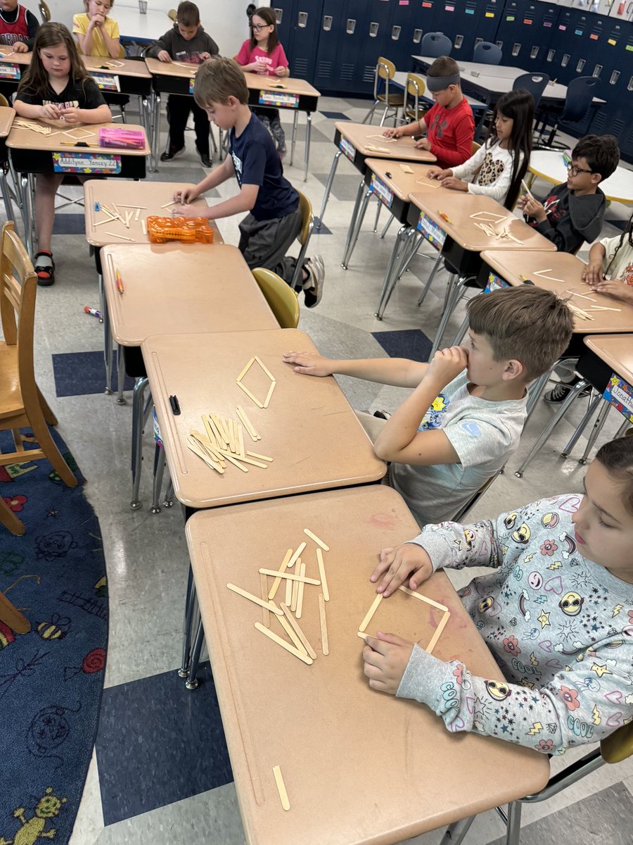 Mrs. Barrett’s class making 2D shapes with popsicle sticks! Who says you need to throw away those sticks after eating a popsicle? #WauseonPride #math #popsicle #shapes
