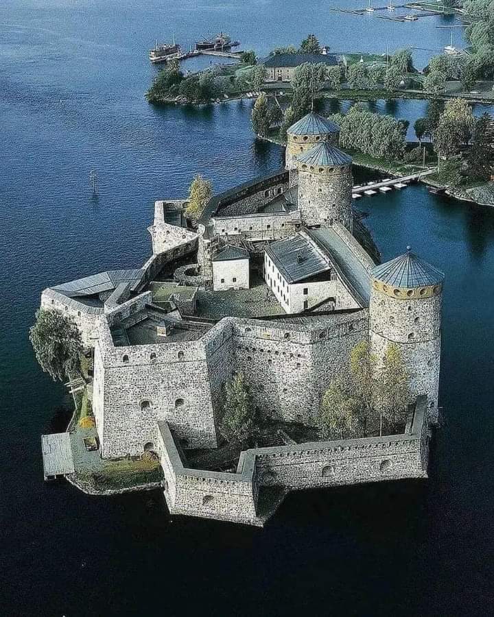 Olavinlinna Castle, located in Savonlinna, Finland, a captivating medieval fortress with a rich history dating back to 1475 AD. Nestled on a rocky island between two lakes, this picturesque castle has stood the test of time and witnessed centuries of Nordic tales. 

Originally