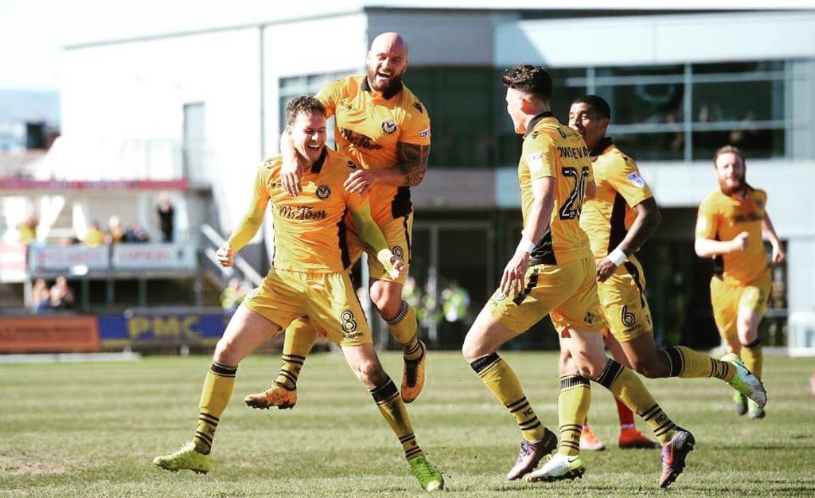 On this day in 2017..
Newport County 1-0 Accrington Stanley
Rodney Parade
Newport County players celebrate with Mark Randall after his cross was diverted in to secure a 1-0 home win over Accrington Stanley.