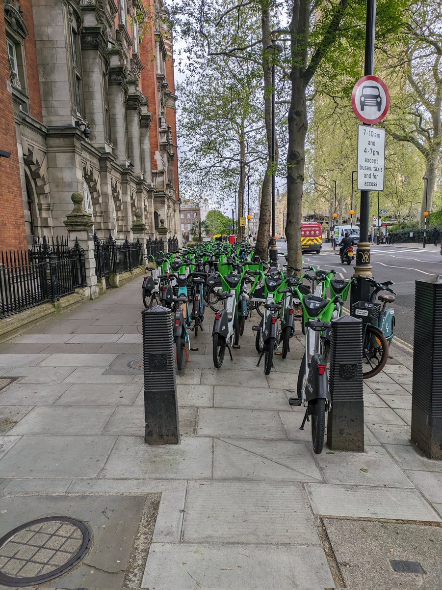 KateWallis's tweet photo. @limebike can you send someone to deal with the proliferation of bikes on Millbank which have nearly blocked the footpath and have blocked access to the bike racks and zebra crossing? https://t.co/ktHtItCFG3
