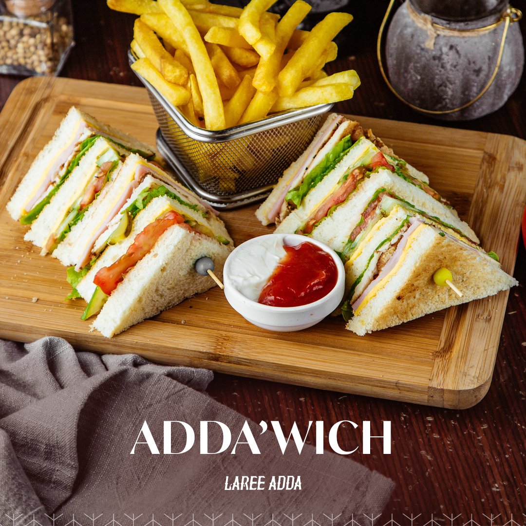 'Adda’Wich' – the ultimate club sandwich experience you've been craving! Three layers of perfectly toasted bread stacked with boneless chicken tikka, hearty slices of hard-boiled egg, juicy tomatoes, crisp cucumber, and creamy mayo. lareeadda.com #lareeadda #AddaWich