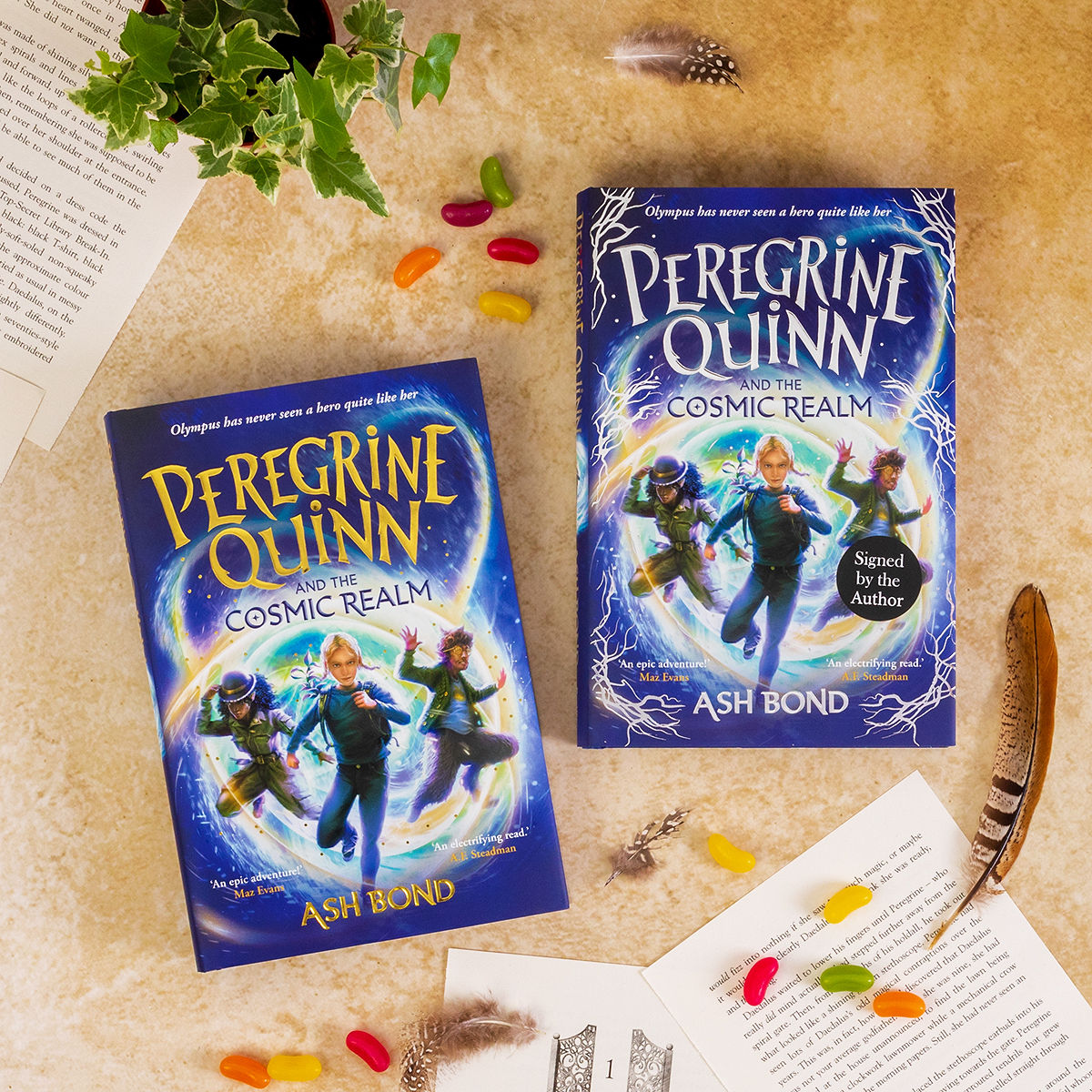 It's publication week for @ashbwrites' PEREGRINE QUINN AND THE COSMIC REALM! ✨ We can't believe this incredible, adventurous, utterly magical book is landing on shelves this Thursday. Which edition are grabbing: gold, or the indie exclusive silver? lnk.to/TheCosmicRealm