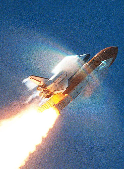 Space Shuttles typically went transonic approximately 45 seconds after launch. Here is an impressive picture of the Atlantis mission STS-106 on September 8, 2000 with the shock wave forming a rainbow effect.