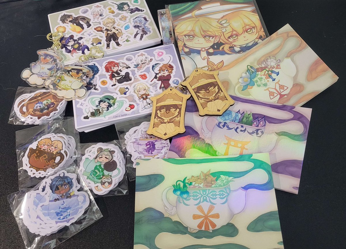 🫖🌟 UPDATE
Slow and steady wins the race, dear patrons! 

Our merchandise has finally arrived! Books are still in progress due to a fussy manufacturer, but we're well on our way to completion!