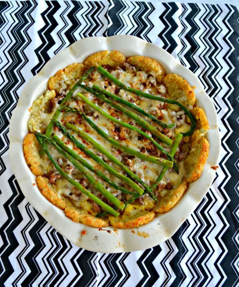 Make a delicious brunch with this Hash Brown Crusted Casserole with Eggs, Cheese, and Asparagus for an all in one pan kind of meal! #breakfast #brunch #eggs #hashbrowns hezzi-dsbooksandcooks.com/hash-brown-cru…