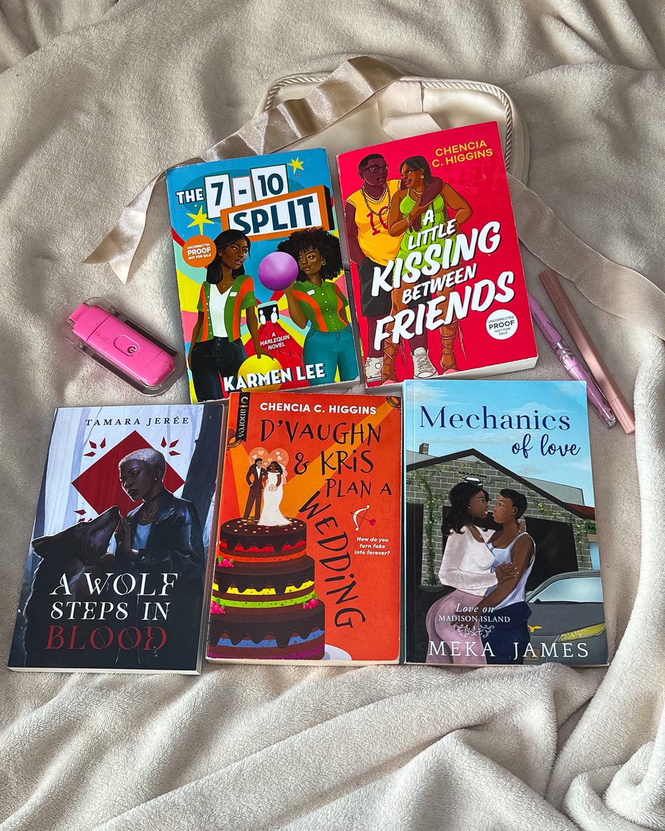 Just a black lesbian and her books with black lesbians 🧡🤍💗 Also happy lesbian visibility week