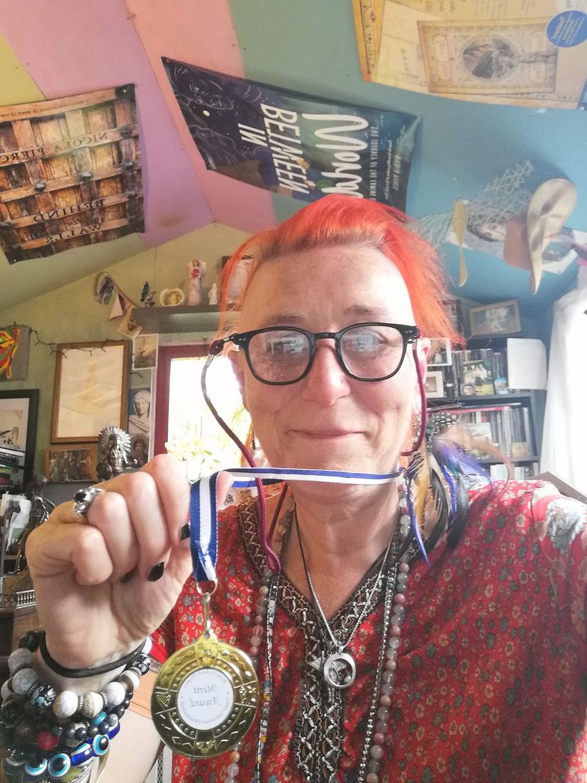 At an awards ceremony for young writers last week one of the organisers heard me tell a child and his mother that I have never won anything for my writing and so she gave me one of the leftover medals. I am wearing it to work today ...!