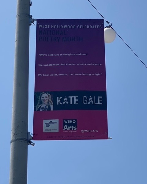 Tomorrow is the launch date for UNDER A NEON SUN the debut novel of the fabulous @Kate_Gale, director of @RedHenPress. Kate is also an acclaimed poet, and this weekend, HER poetry was up on banners is West Hollywood. What an honor to work with her!