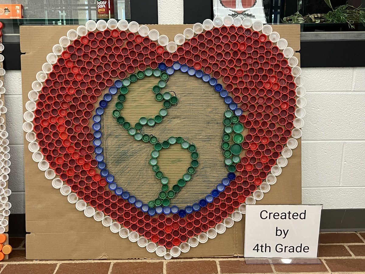 Happy 🌎#EarthDay2024 ! So proud of our @JGB_Library students for creating these recycled lid projects for the @studentsrebuild #ExtraordinaryEarth Challenge. 5th grade created the Earth & hands. 4th grade created the Earth & heart. Our Library Helpers were a HUGE help! 💛🦒