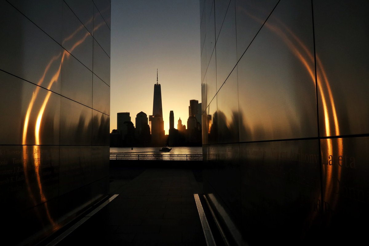 Sunrise behind lower Manhattan and One World Trade Center in New York City seen from the Empty Sky 9/11 Memorial in Liberty State Park in Jersey City, NJ Monday morning #nyc #newyork #NewYorkCity #sunrise