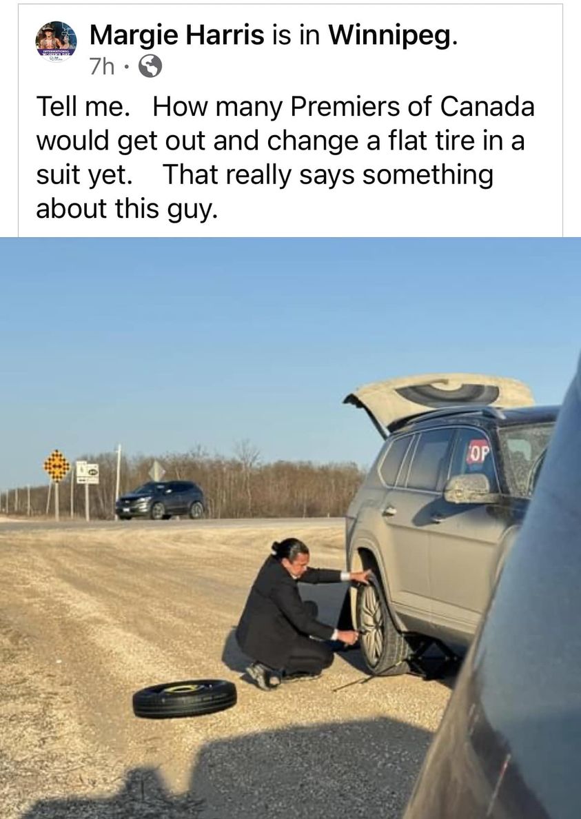 Here's the premier of Manitoba, out fixing a flat tire. Can you believe Druggie has EVER done this? Just laughing at the thought