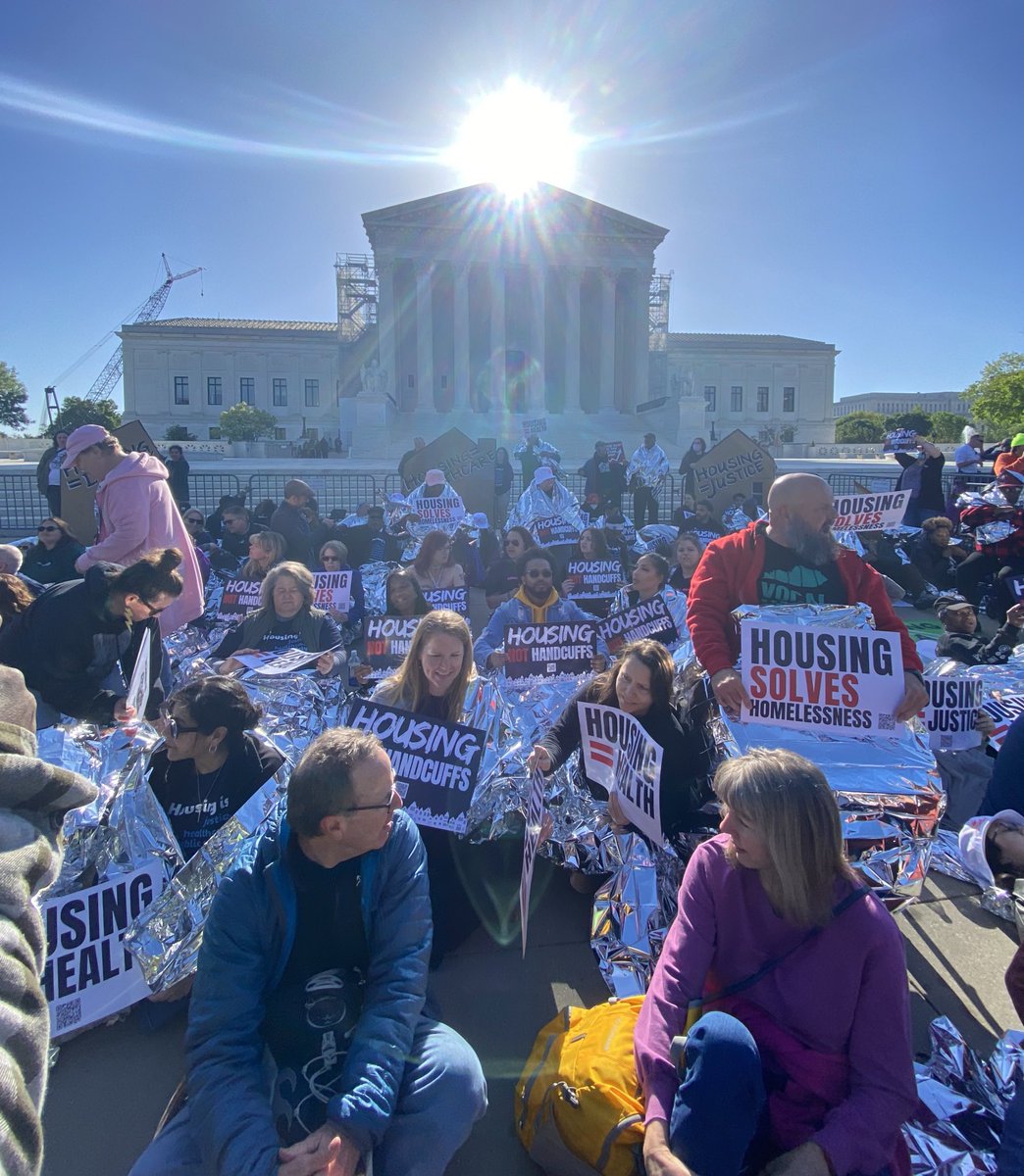 Homeless advocates have organized a “lie-in” with blankets to protest the criminalization of sleeping